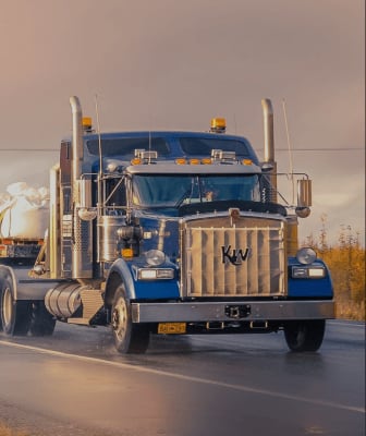 A haulage truck carrying a container